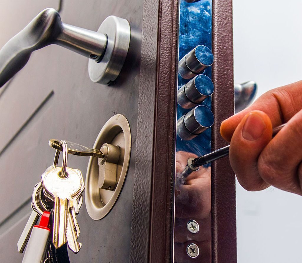 Original illustration of a locksmith working with a secure door lock